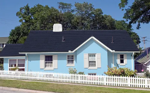 OKC home with 'Pale Sky Blue' exterior paint - reflects heat for Oklahoma summers